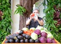 Asian old elderly elder woman with fruit vegetables in wooden cart wagon from farm Royalty Free Stock Photo