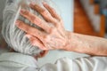 Asian old elderly holding her back of head,emergency headache,painful occurs after a blow to the head,high intracranial pressure, Royalty Free Stock Photo