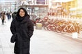 Asian old lady Wearing a sweater Overcoat black