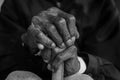 Asian old man sitting with his hands Royalty Free Stock Photo