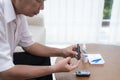 Asian old man test diabetes check by him self Royalty Free Stock Photo