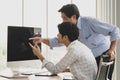 Asian old senior male father stand and young handsome teen son sit use index finger pointing blank empty black computer monitor