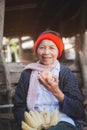 Asian old woman eating apple and bananas with smile and happy.Concept of Healthy Food for Seniors