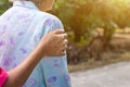 Asian old woman standing with her hands on a walker with daughter& x27;s hand,Hand of old woman holding a staff cane for helping Royalty Free Stock Photo