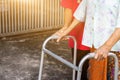 Asian old woman standing with her hands on a walker with daughter& x27;s hand,Hand of old woman holding a staff cane for helping Royalty Free Stock Photo