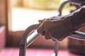 Asian old woman standing with her hands on a walker stand,Hand o Royalty Free Stock Photo