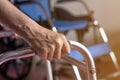 Asian old woman standing with her hands on a walker stand,Hand o Royalty Free Stock Photo