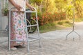 TheÃ¢â¬â¹ Asian old woman standing with his hands on a walking stick,Hand of old woman holding a staff cane Royalty Free Stock Photo