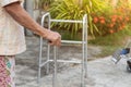 TheÃ¢â¬â¹ Asian old woman standing with his hands on a walking stick,Hand of old woman holding a staff cane