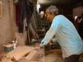 an asian old worker making furniture at sawmill in India January 2020 Royalty Free Stock Photo