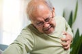 Asian older man have congenital disease suffering from heartache alone at home Royalty Free Stock Photo