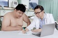 Doctor talking to an overweight patient Royalty Free Stock Photo