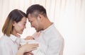 Asian parents with newborn baby, Close up portrait of asian young couple father mother holding kissing their new born baby in hosp Royalty Free Stock Photo