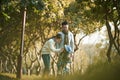 Asian parents taking care of child outdoors in park Royalty Free Stock Photo