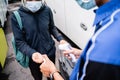 Asian passenger temprature check and hand sanitize