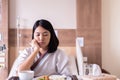 Asian patient woman feeling unhappy and bored meal,Loss of appetite,Boredom eating Royalty Free Stock Photo