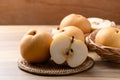 Asian pear fruit or Nashi pear on wooden background Royalty Free Stock Photo