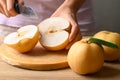 Asian pear or Nashi pear cutting on wooden board Royalty Free Stock Photo