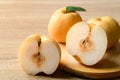 Asian pear or Nashi pear on wooden background Royalty Free Stock Photo