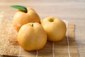 Asian pear or Nashi pear on wooden background Royalty Free Stock Photo