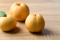 Asian pear or Nashi pear on wooden background Royalty Free Stock Photo