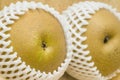 Asian pears in shipping net Royalty Free Stock Photo