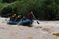 asian people in action at rafting adventure