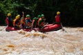 Asian people in action at rafting adventure