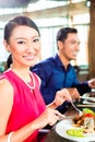 Asian people fine dining in restaurant Royalty Free Stock Photo