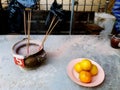 Asian people offer incense sticks, food, fruit and drink to respecting or wish to buddha statue, dead family, forefather and god f Royalty Free Stock Photo