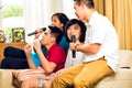 Asian people singing at karaoke party Royalty Free Stock Photo