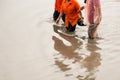 Asian people walking on flooding road during monsoon season Royalty Free Stock Photo