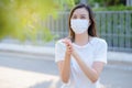 Asian peoploe using alcohol antiseptic gel and wearing prevention mask,prevent against infection of Covid-19 outbreak,woman