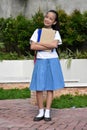 Happy Young Minority Girl Student Wearing Bookbag With Notebooks Standing