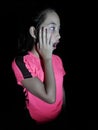 Shocked Philippina Girl Child Wearing Pink Isolated On Black