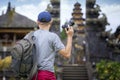 Asian photographer travel in old temple in Bali