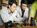 Asian photographers at work Royalty Free Stock Photo