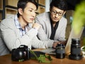 Asian photographers at work Royalty Free Stock Photo
