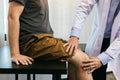 Asian physiotherapists are checking patients' knees