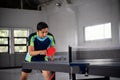 Asian ping pong players in a position ready to compete Royalty Free Stock Photo