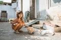 Asian playing with cat at java traditional home Royalty Free Stock Photo