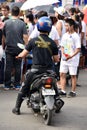 An Asian Police Officer On Motorcycle