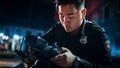 Asian Policeman Taking Photos of Evidence on a Crime Scene at Night. Forensics Police Officer Finds