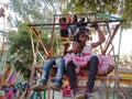 Asian poor village childrens enjoying swing at local fair program in India January 2020 Royalty Free Stock Photo