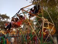 Asian poor village childrens enjoying swing at local fair program in India January 2020 Royalty Free Stock Photo