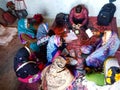 Asian poor women gathering during small finance bank loan repayment procedure in India January 2020