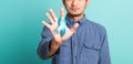 Handsome man posing he holding light blue ribbon for supporting people living Royalty Free Stock Photo