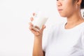 Woman use hands hold drink white milk from a glass Royalty Free Stock Photo