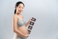 Asian pregnant smile woman and ultrasound film