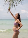 Asian pregnant woman posture on tropical sand beach with palm tree in sunny day in Thailand. Pregnancy relaxation from depression Royalty Free Stock Photo